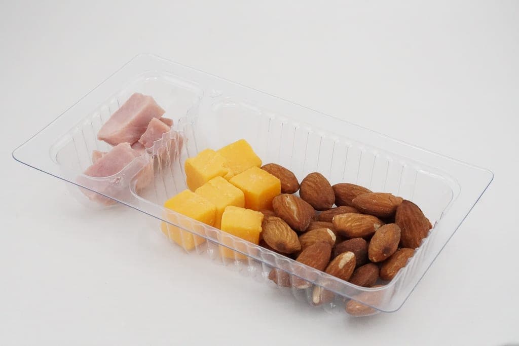 Packaged entrees and produce cups ready for distribution